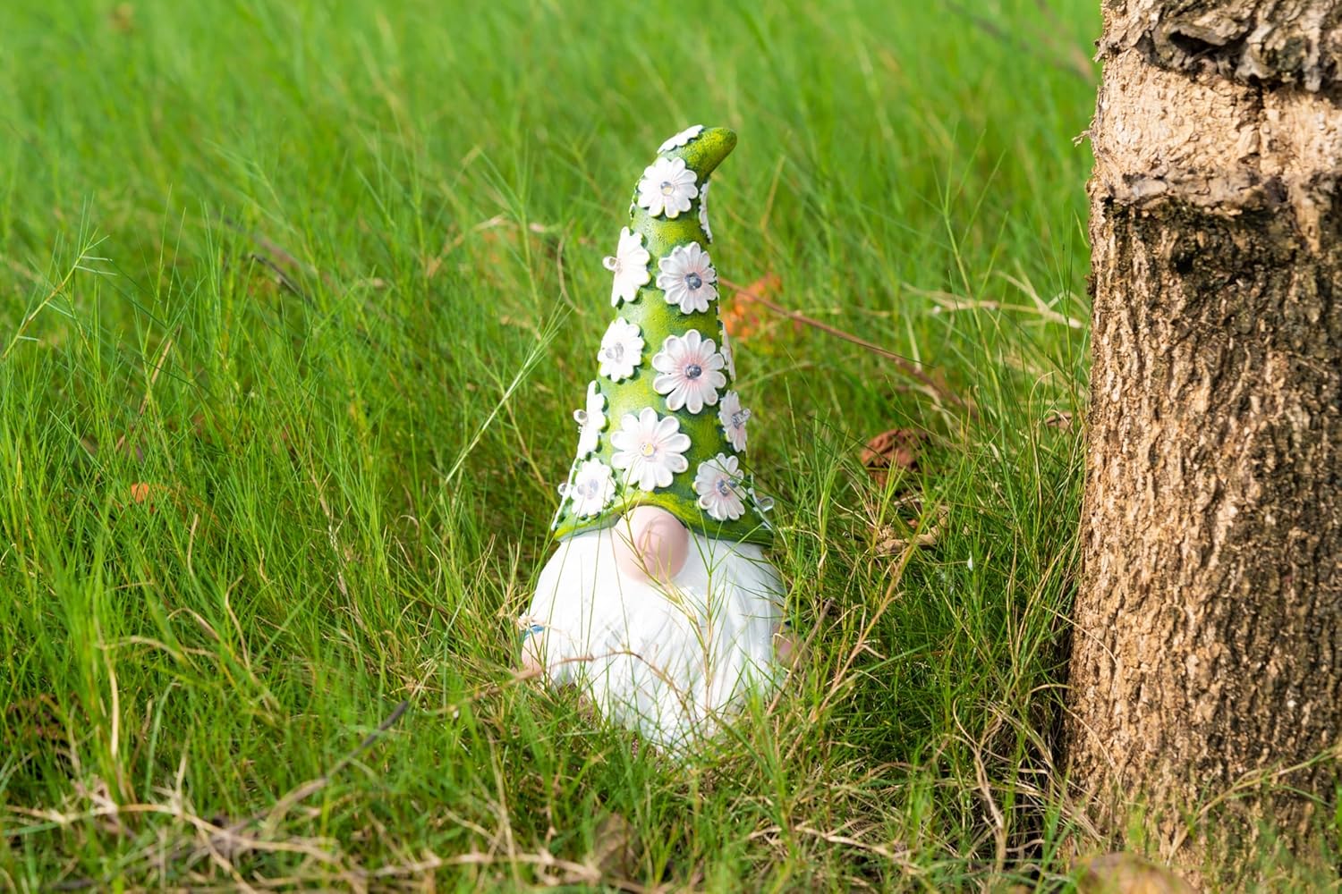 Showcases a spring-themed garden gnome to appeal to customers looking for seasonal outdoor decorations.