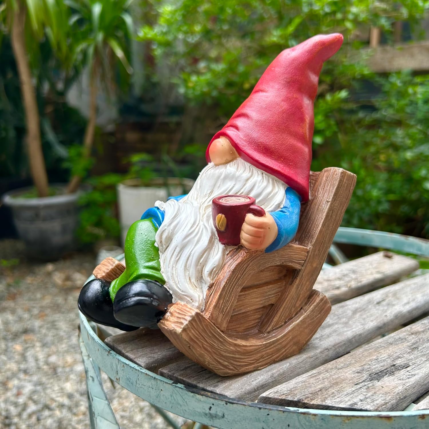 Shows the product in a natural outdoor setting to demonstrate its use as a decorative garden ornament.