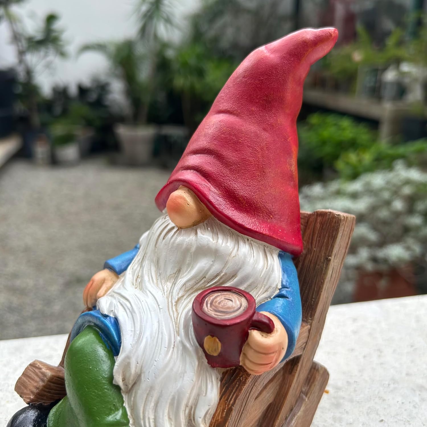 Shows the product in a realistic outdoor garden setting to help customers visualize how it would look in their own space.
