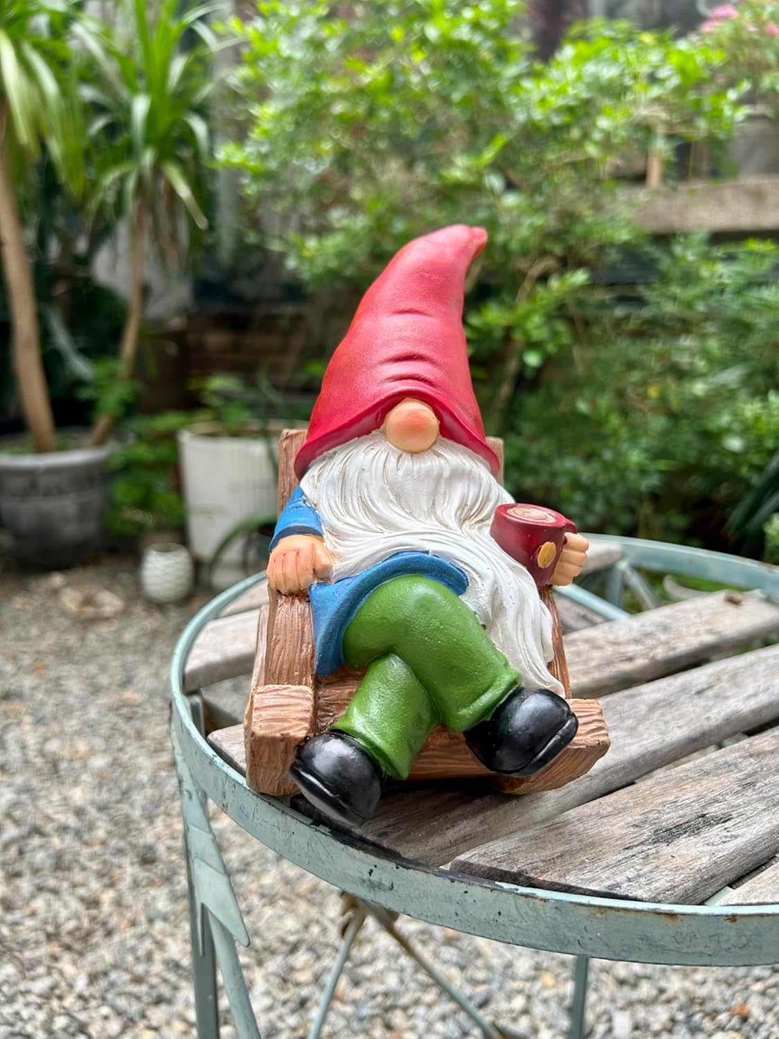 Shows the product in a realistic outdoor setting to demonstrate how it can be used as a decorative element in a garden or patio.