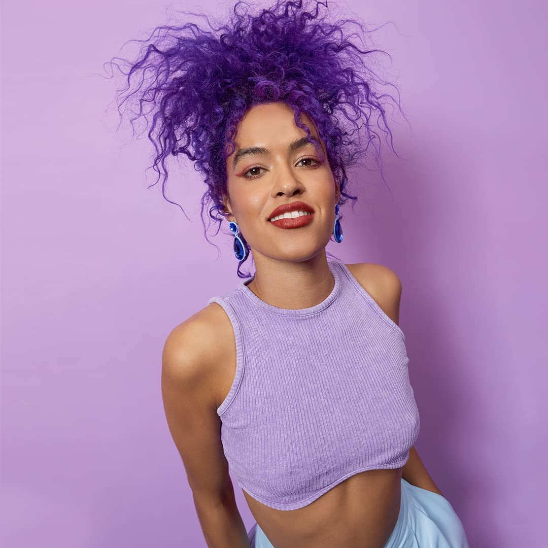 Showcases a bold, vibrant purple hair color to appeal to customers interested in expressive, unconventional hair styles.