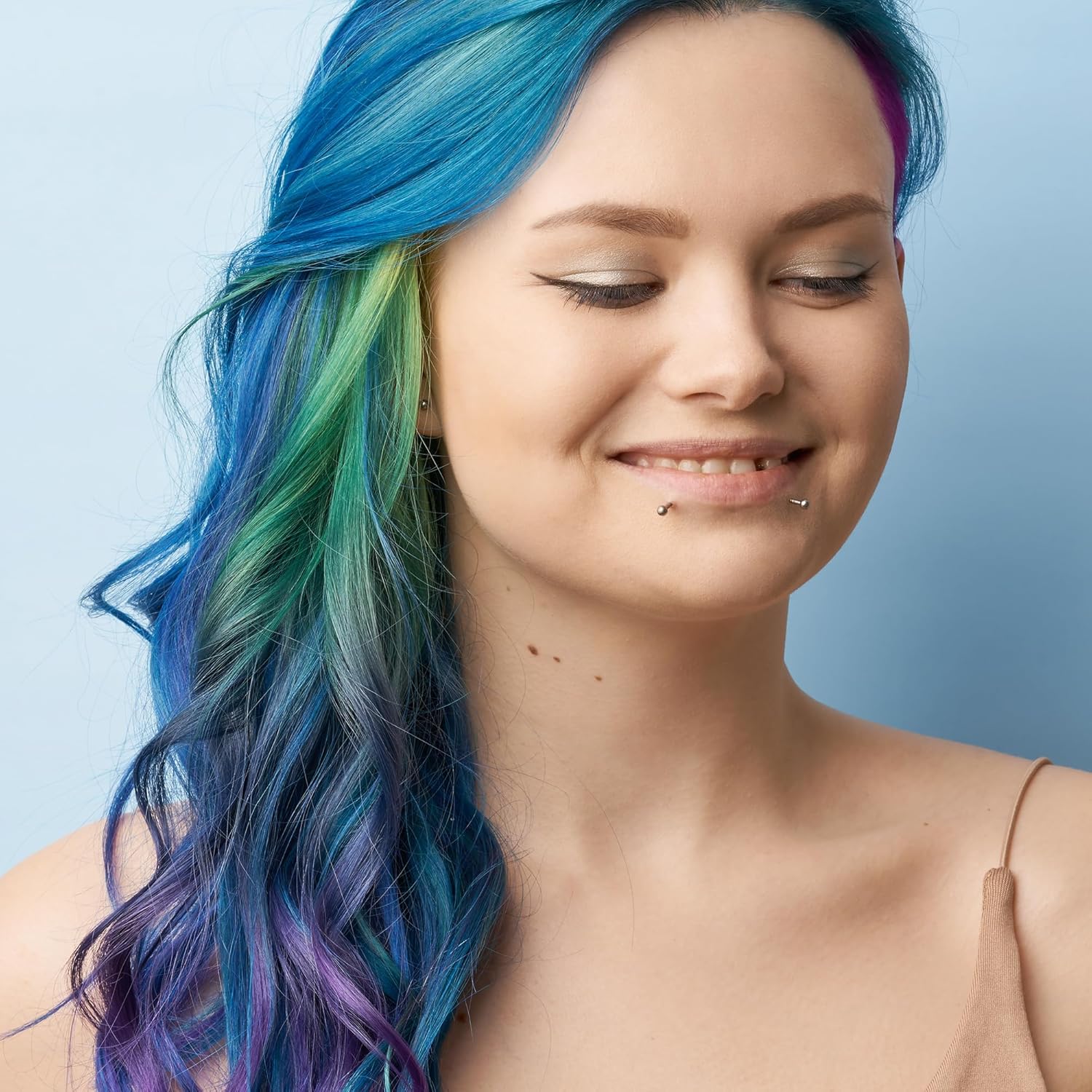 Showcases the vibrant, multi-colored hair dye result to attract customers interested in bold, expressive hair colors.