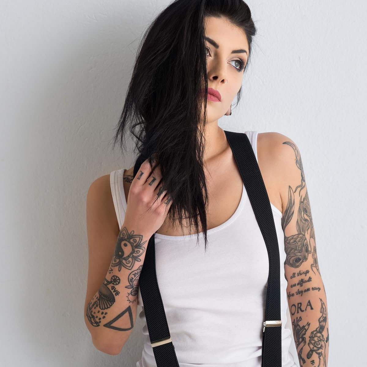 Showcases the product being worn by a model with an alternative style, appealing to customers interested in edgy fashion.