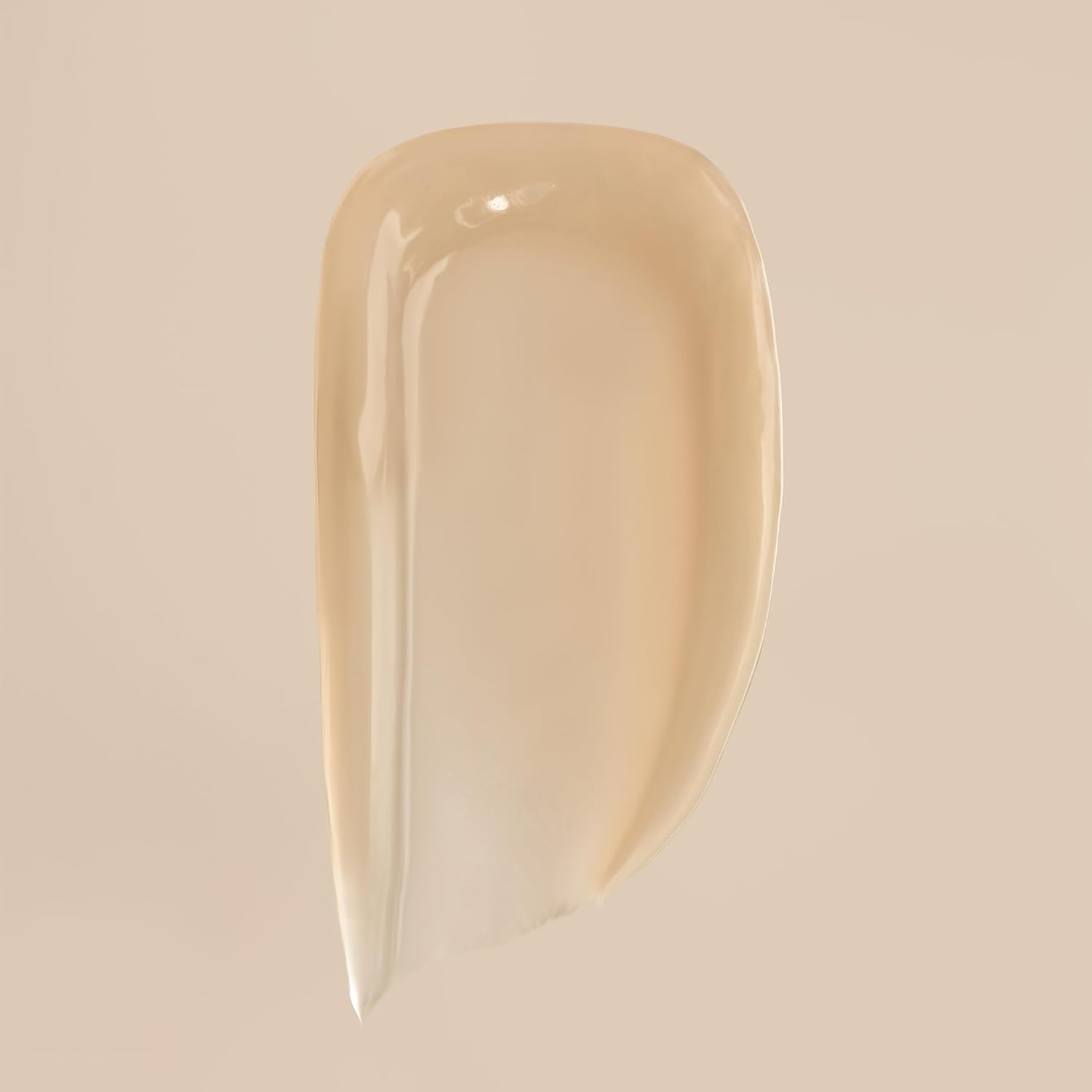 Demonstrates the creamy, smooth texture of the product to highlight its quality and ease of application.
