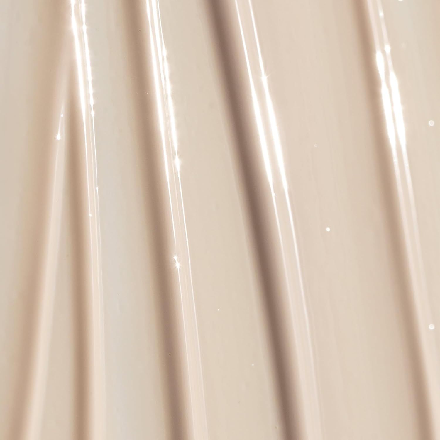 Highlights the product's smooth and creamy texture to convey its luxurious quality and ease of application.