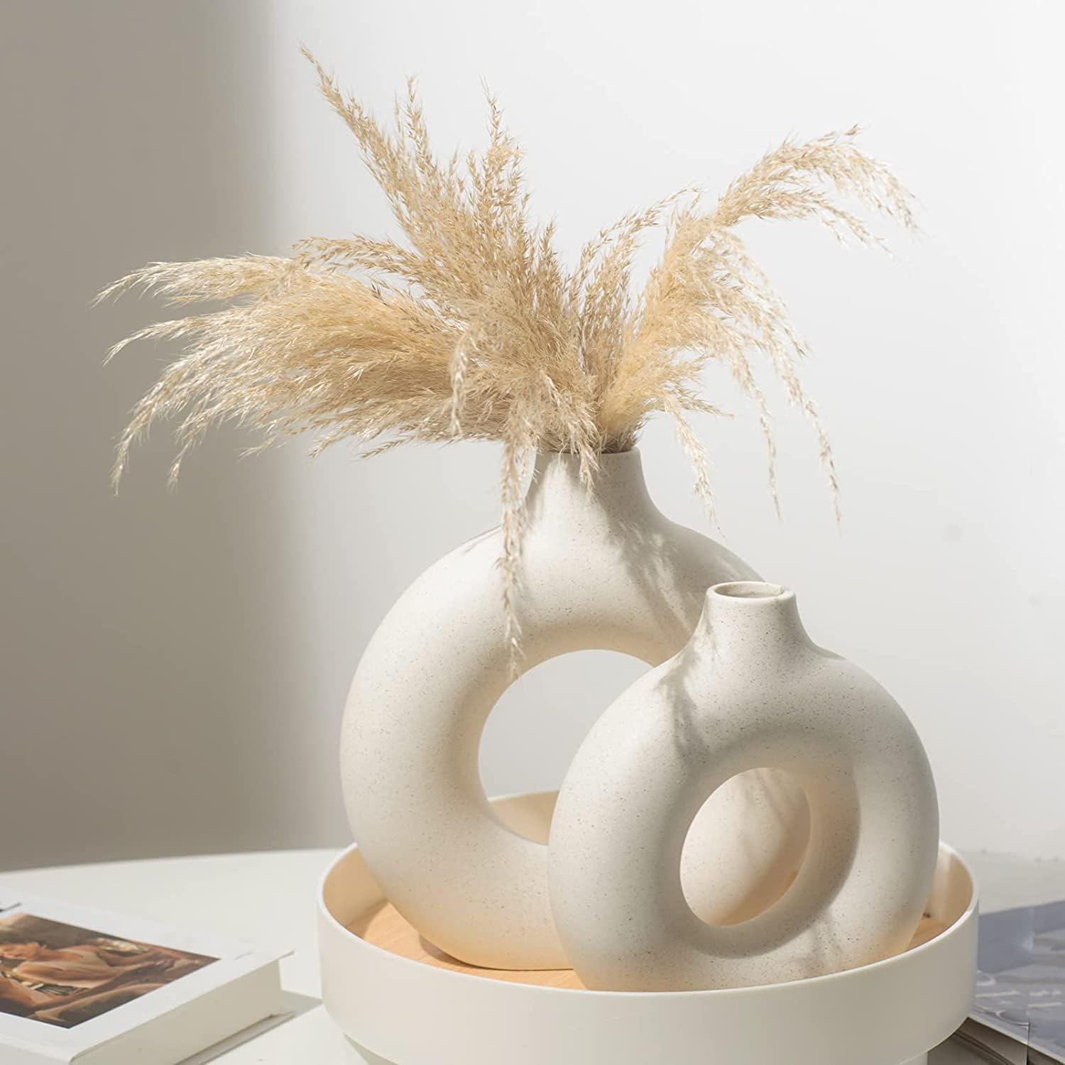 Showcases the product in a stylish, minimalist home setting to appeal to design-conscious consumers.