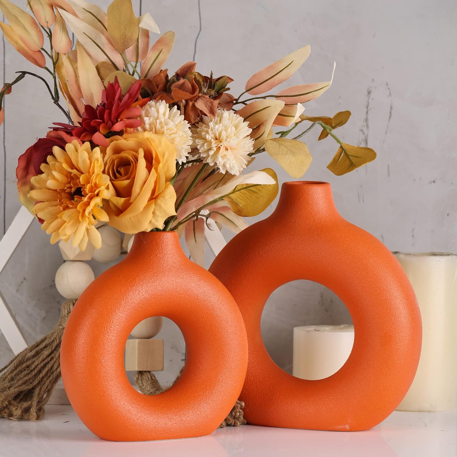 Showcases the product as a stylish seasonal decoration for fall, emphasizing warm colors and floral arrangements. Demonstrates how the product can be used to create an attractive display in a home…