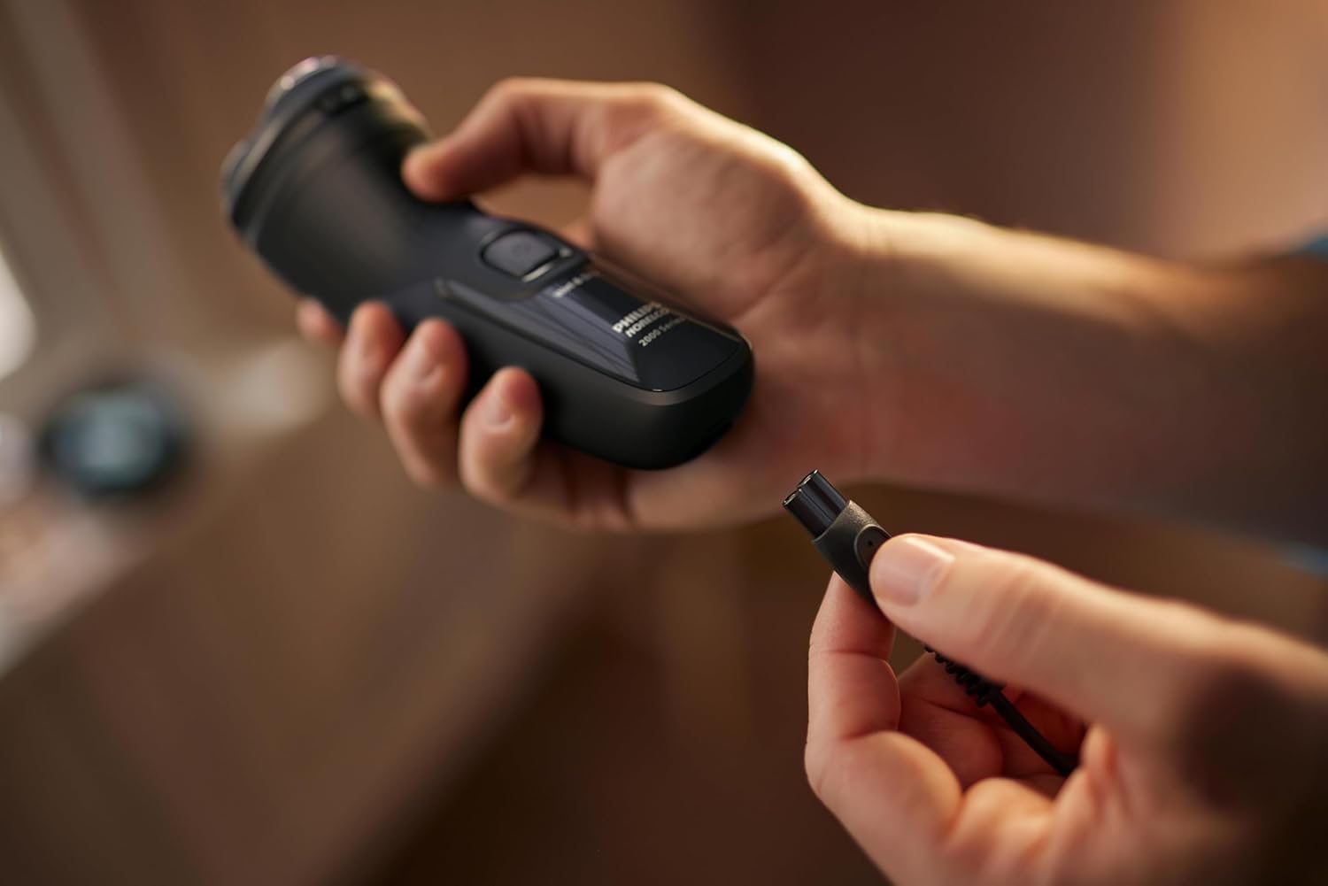 Demonstrates how to easily attach or detach an accessory to the main device, highlighting the product's user-friendly design.