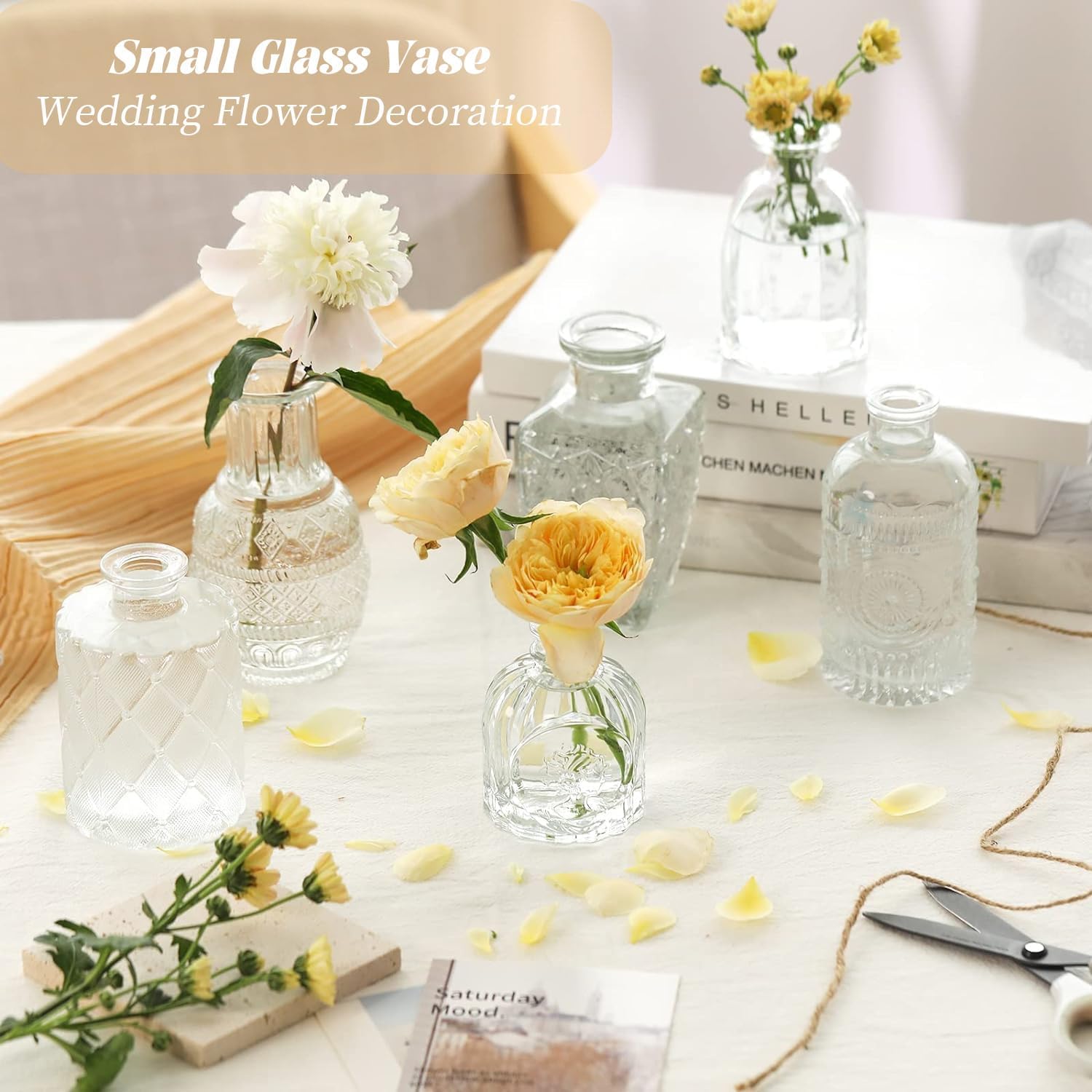 Showcases how the small glass vases can be used to create an elegant and romantic wedding table setting. Demonstrates various ways to use small glass vases for floral arrangements in wedding decor.