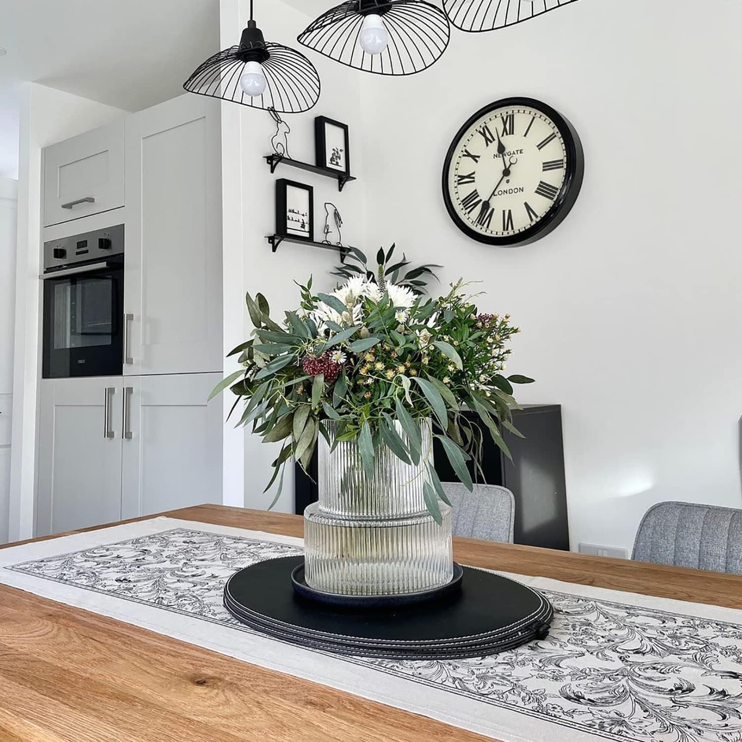 Showcases the product in a stylish, contemporary kitchen setting to help shoppers envision how it would look in their own home.