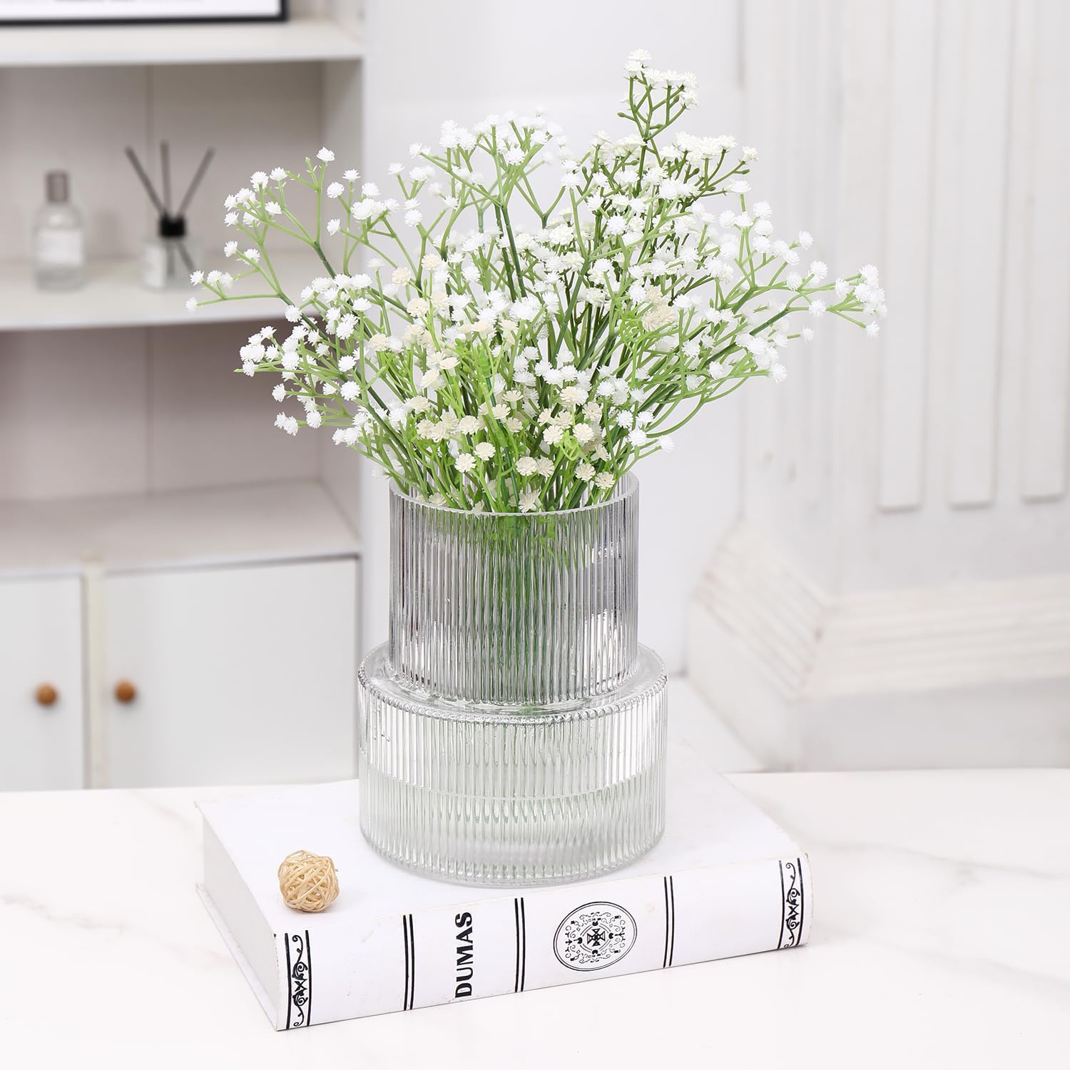 Shows how the product can be used to create an elegant and fresh atmosphere in a home setting.