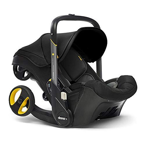 Shows the product in its intended use context as an infant car seat, highlighting its design and functionality.