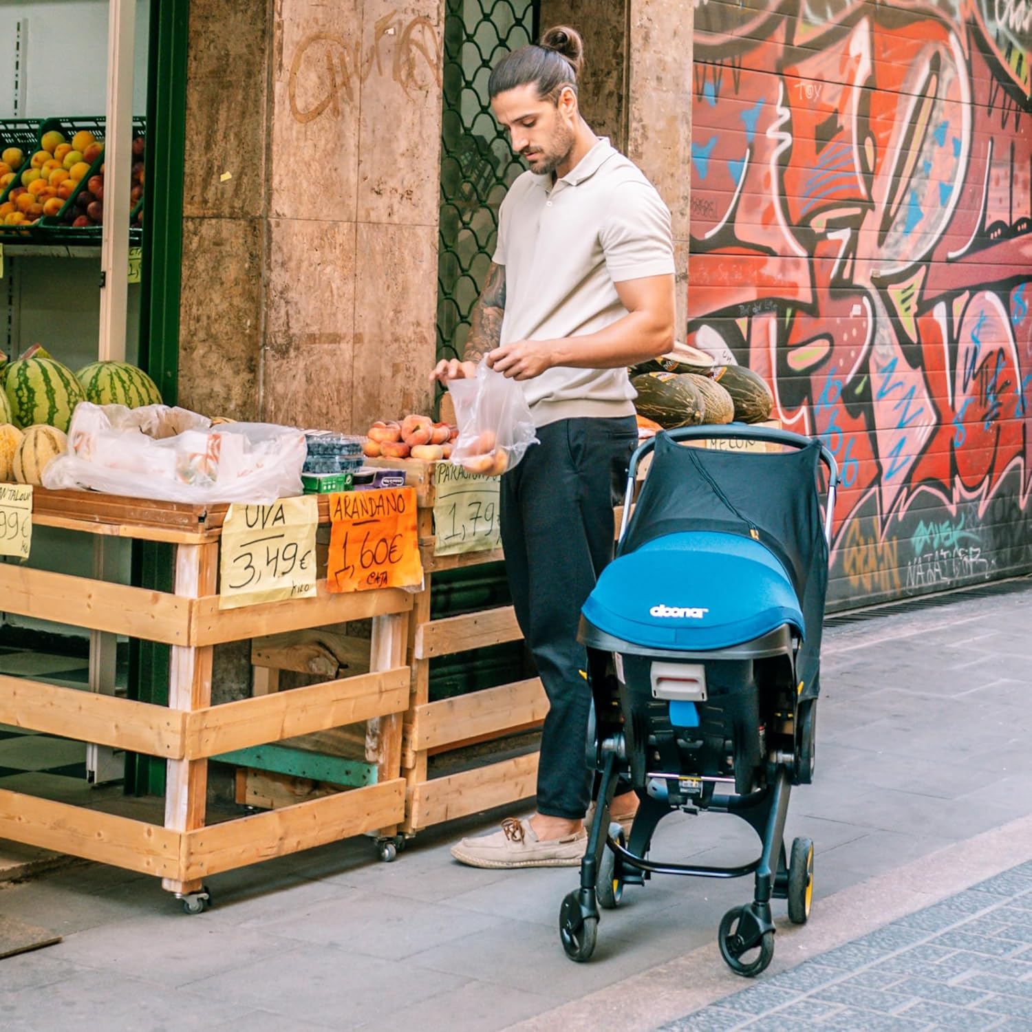 Shows the product being used in a real-world context, demonstrating its practicality for urban parents running errands.