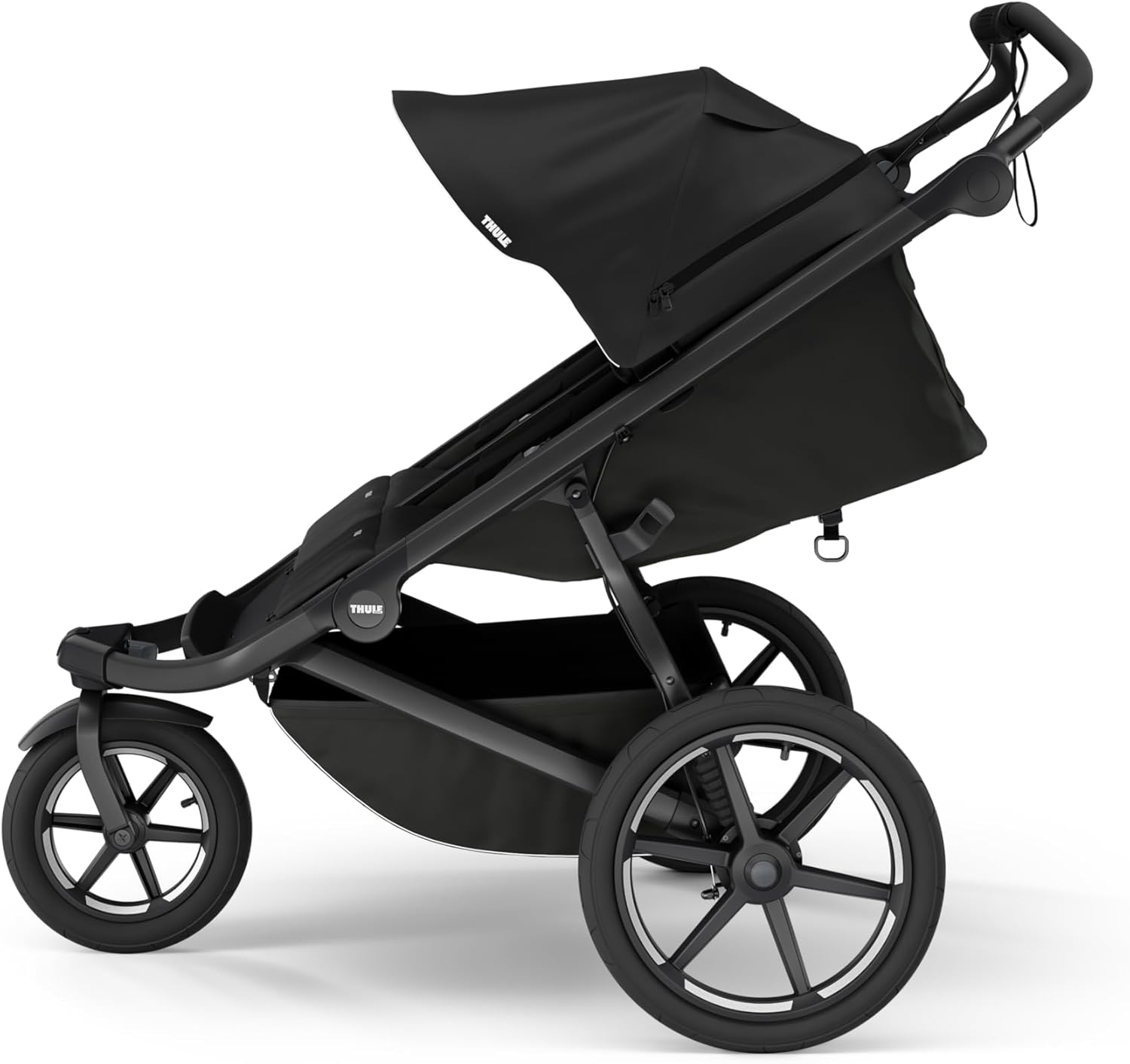 Shows the stroller in a realistic outdoor setting to demonstrate its suitability for everyday use and outdoor activities.