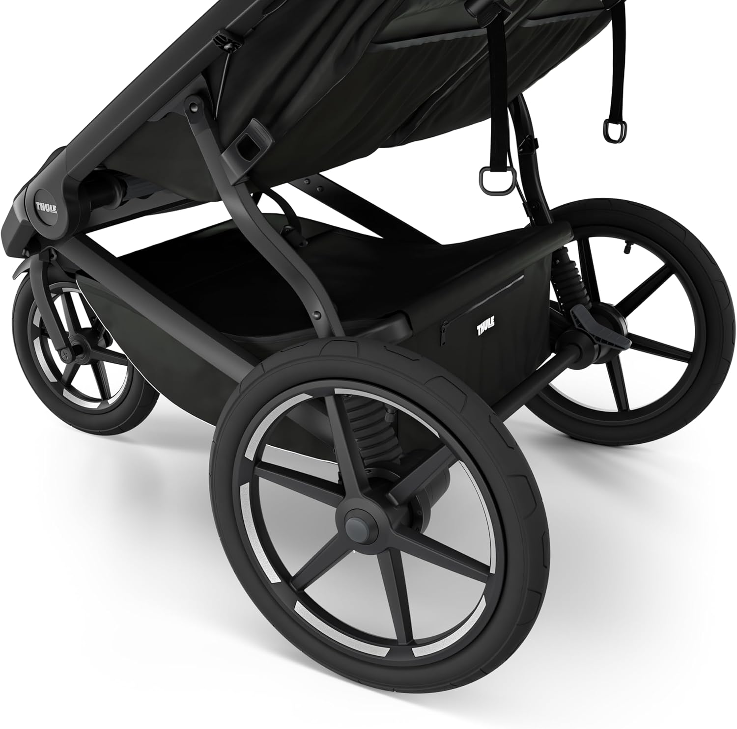 Highlights the stroller's large wheel size to emphasize stability and smooth ride quality.