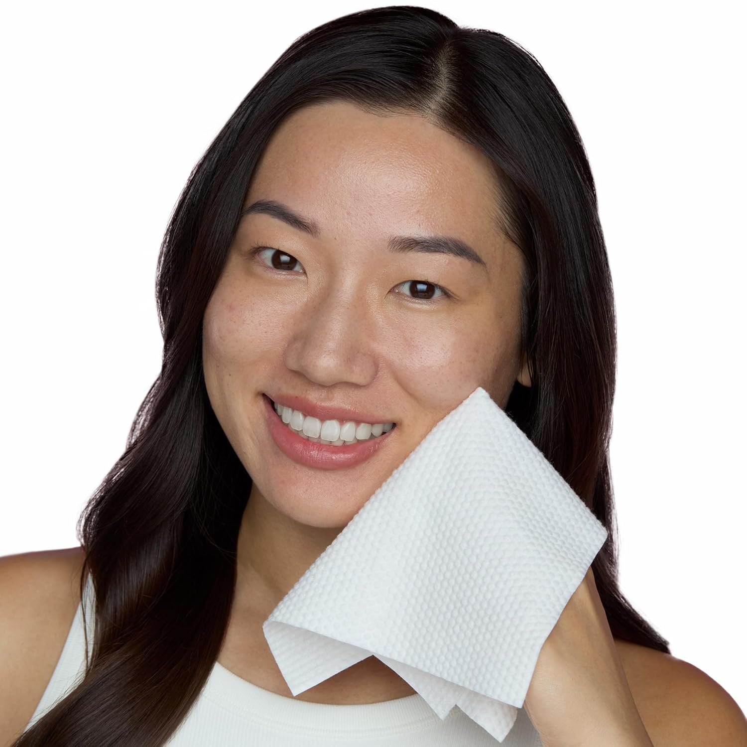 Highlights the softness of the product by showing a smiling woman holding it against her face, implying comfort and gentleness on the skin.