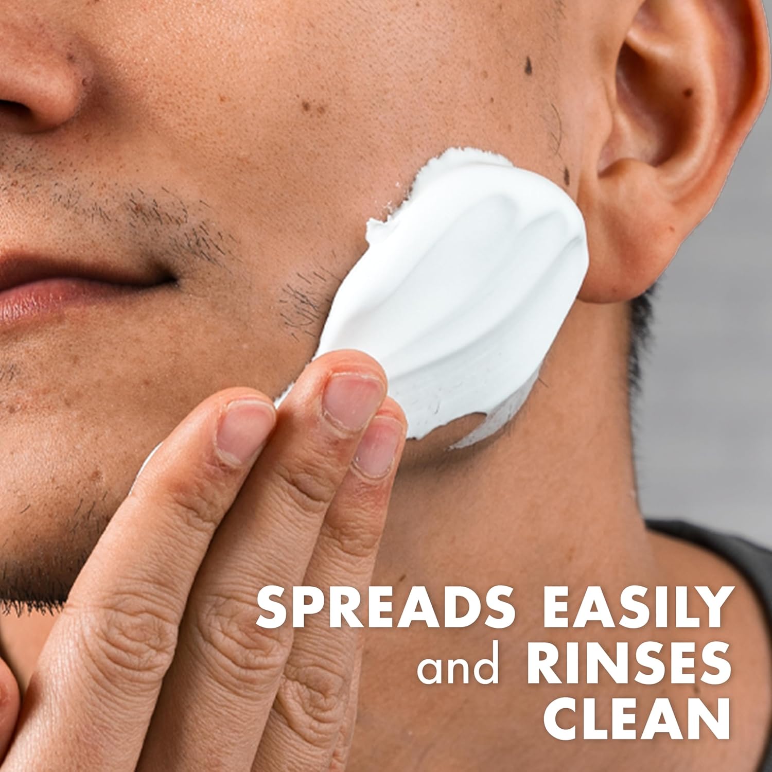 Demonstrates the product's ease of use by showing how it spreads easily on the skin and rinses clean.