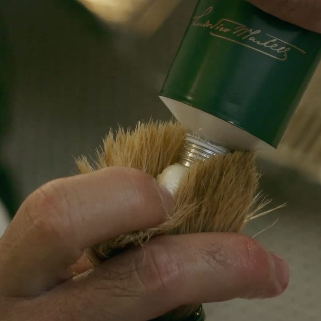 Demonstrates the correct way to apply the product, likely a paint or stain, using a brush for even coverage.