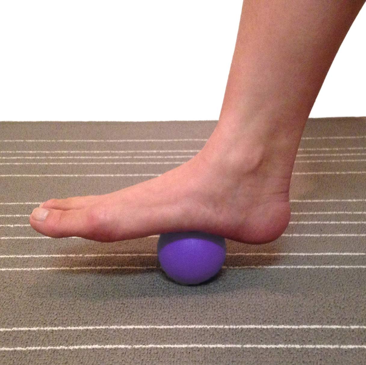 Demonstrates how to use the product for foot massage or pain relief by rolling the foot over the ball.
