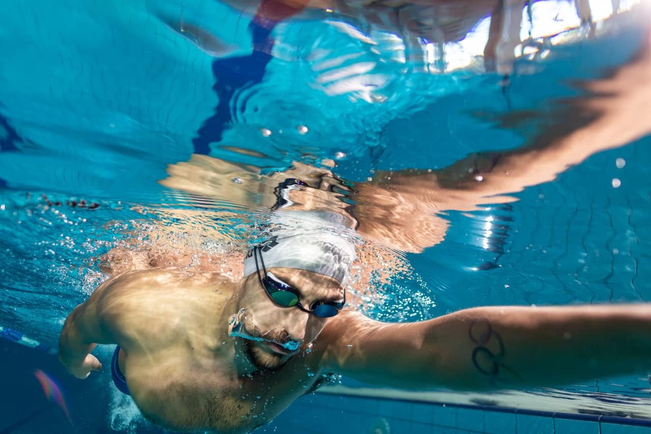Demonstrates the product in use during intense swimming, showcasing its performance and suitability for athletic activities.