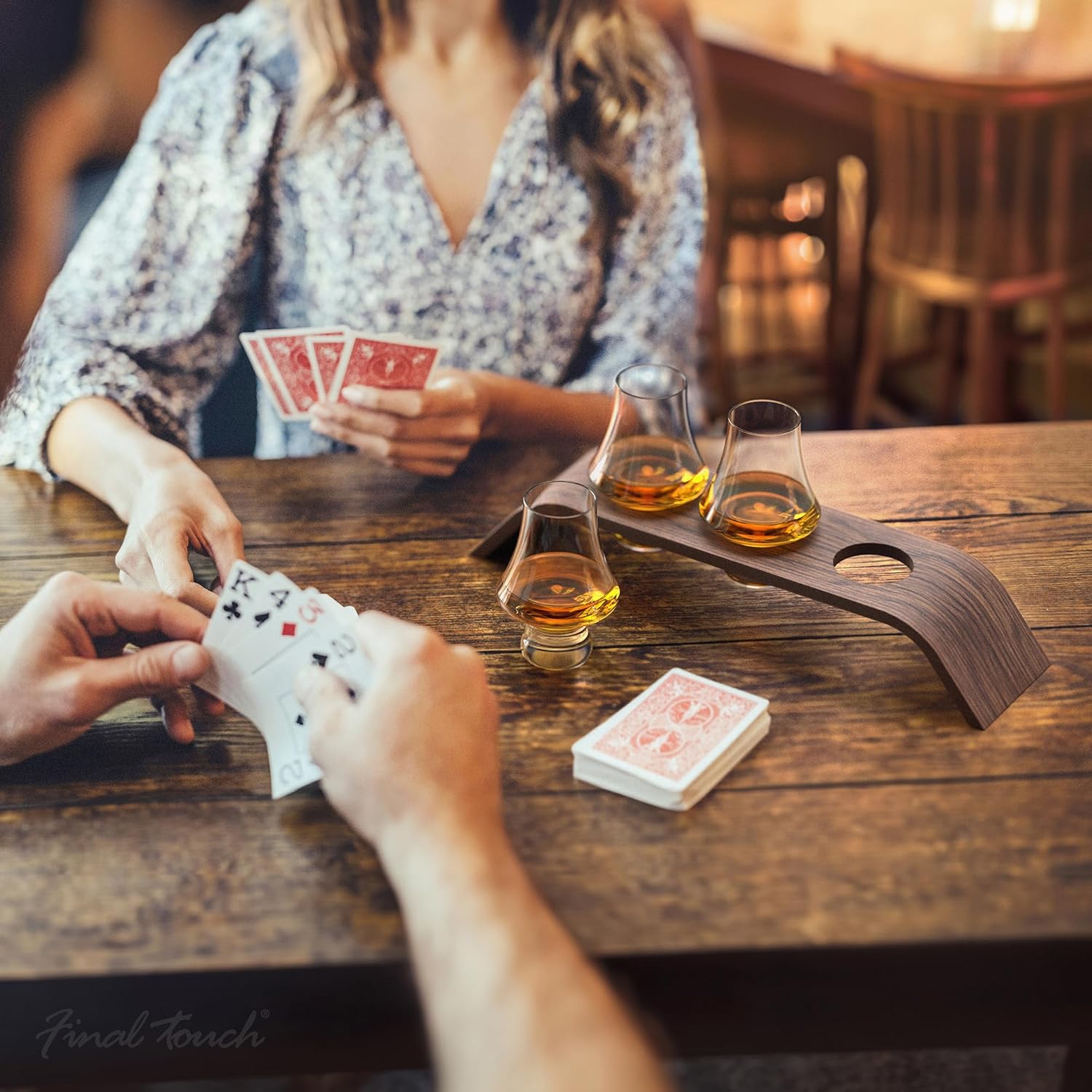 Demonstrates how the product can be used during social activities like card games, enhancing the experience of gatherings.