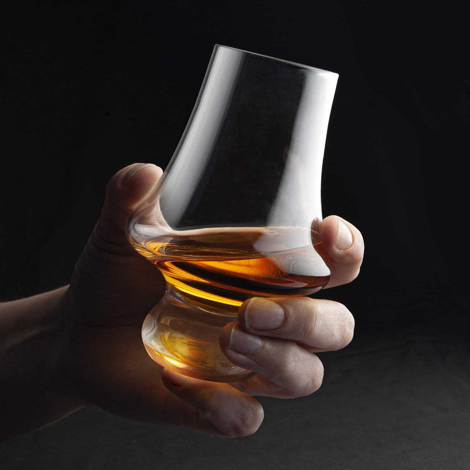 Showcases the product in use, emphasizing its premium design and the luxurious experience of enjoying a fine whiskey.