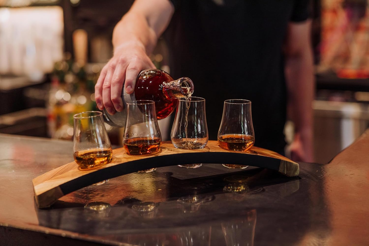 Showcases the product in use, demonstrating how it enhances the whiskey tasting experience in a real-world setting.