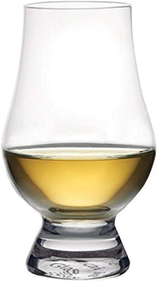 Shows the product (a whiskey glass) in use with liquid inside, demonstrating its appearance and functionality in a real-world context.