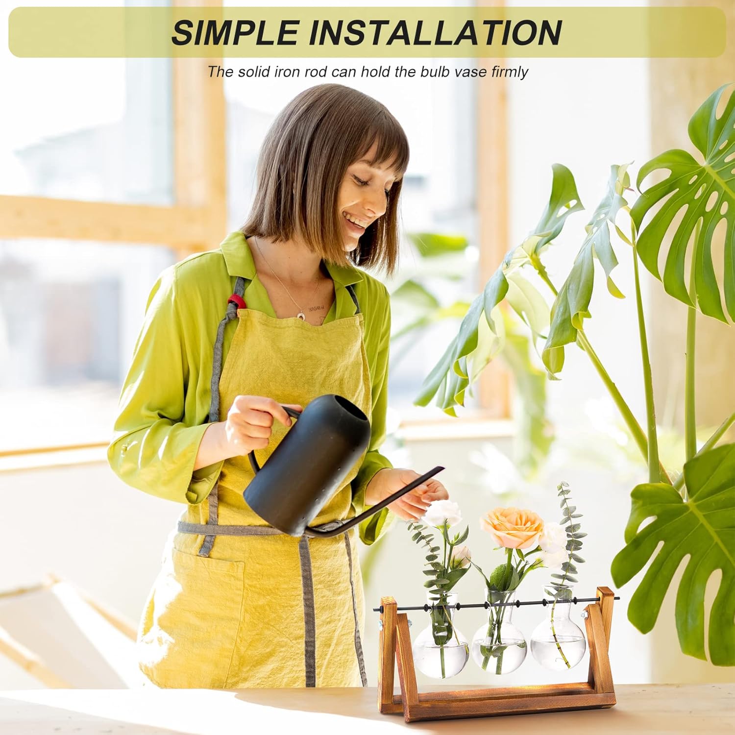 Demonstrates the ease of installing and using the product, showing a woman watering plants in glass vases held by an iron rod. Highlights the simple installation process of the product, emphasizing…