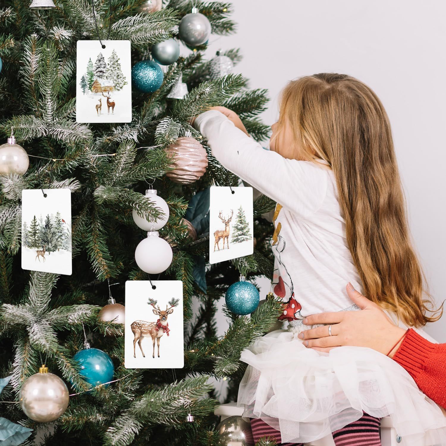 Shows a child decorating a Christmas tree to evoke holiday spirit and family traditions. Depicts a real-world context of decorating for Christmas, emphasizing the product's role in creating festive…