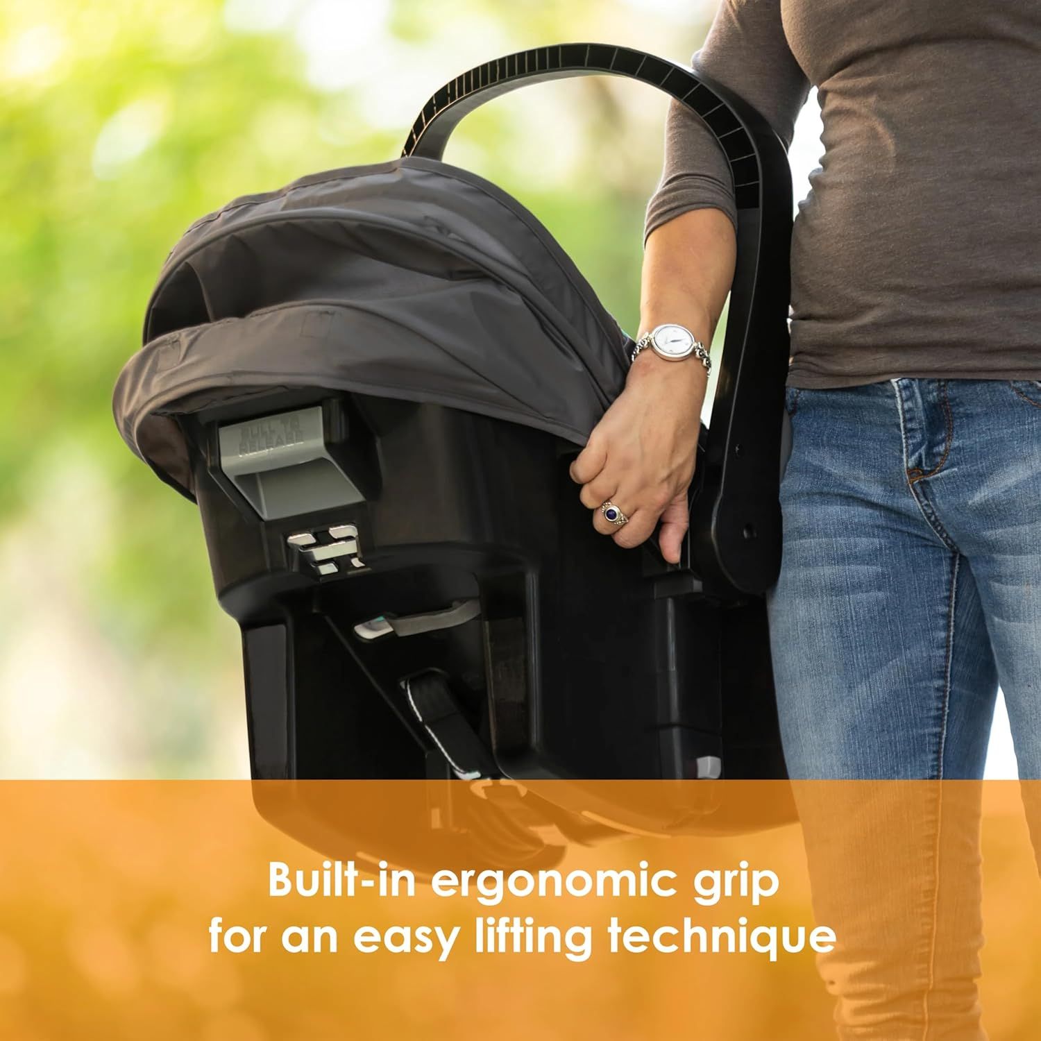 Highlights the built-in ergonomic grip feature to show how it makes lifting and carrying the stroller easier for parents.