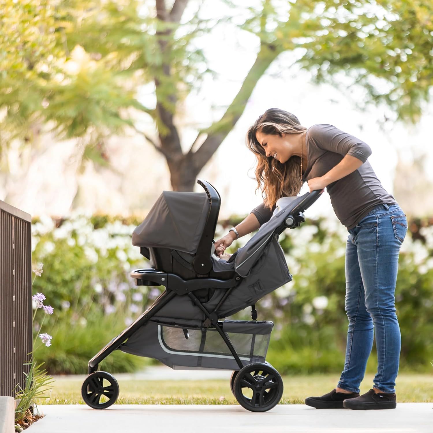 Shows the stroller being used in a real-world outdoor setting, emphasizing its suitability for walks and parent-child bonding.