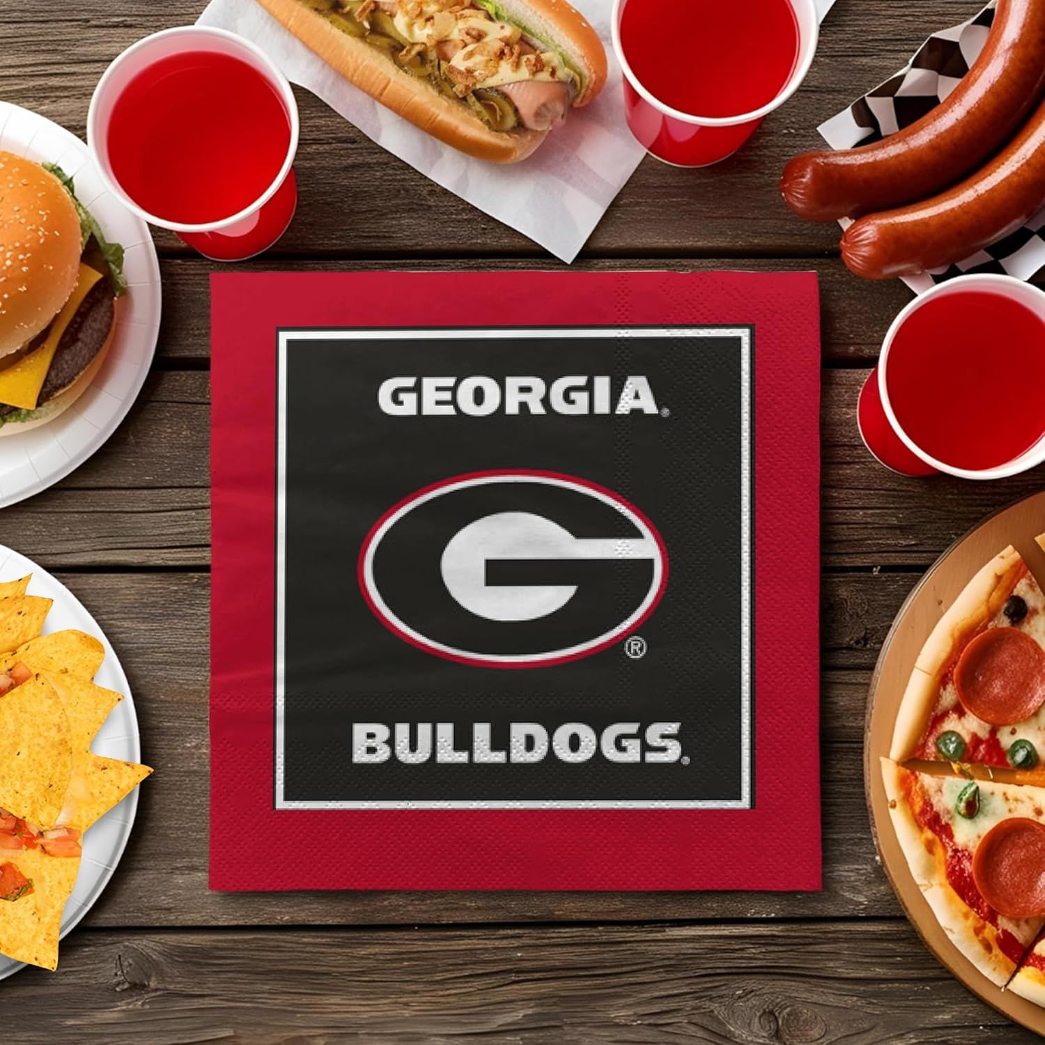 Demonstrates the product is perfect for tailgating and game day gatherings by showing it surrounded by party food and drinks in a festive sports setting.