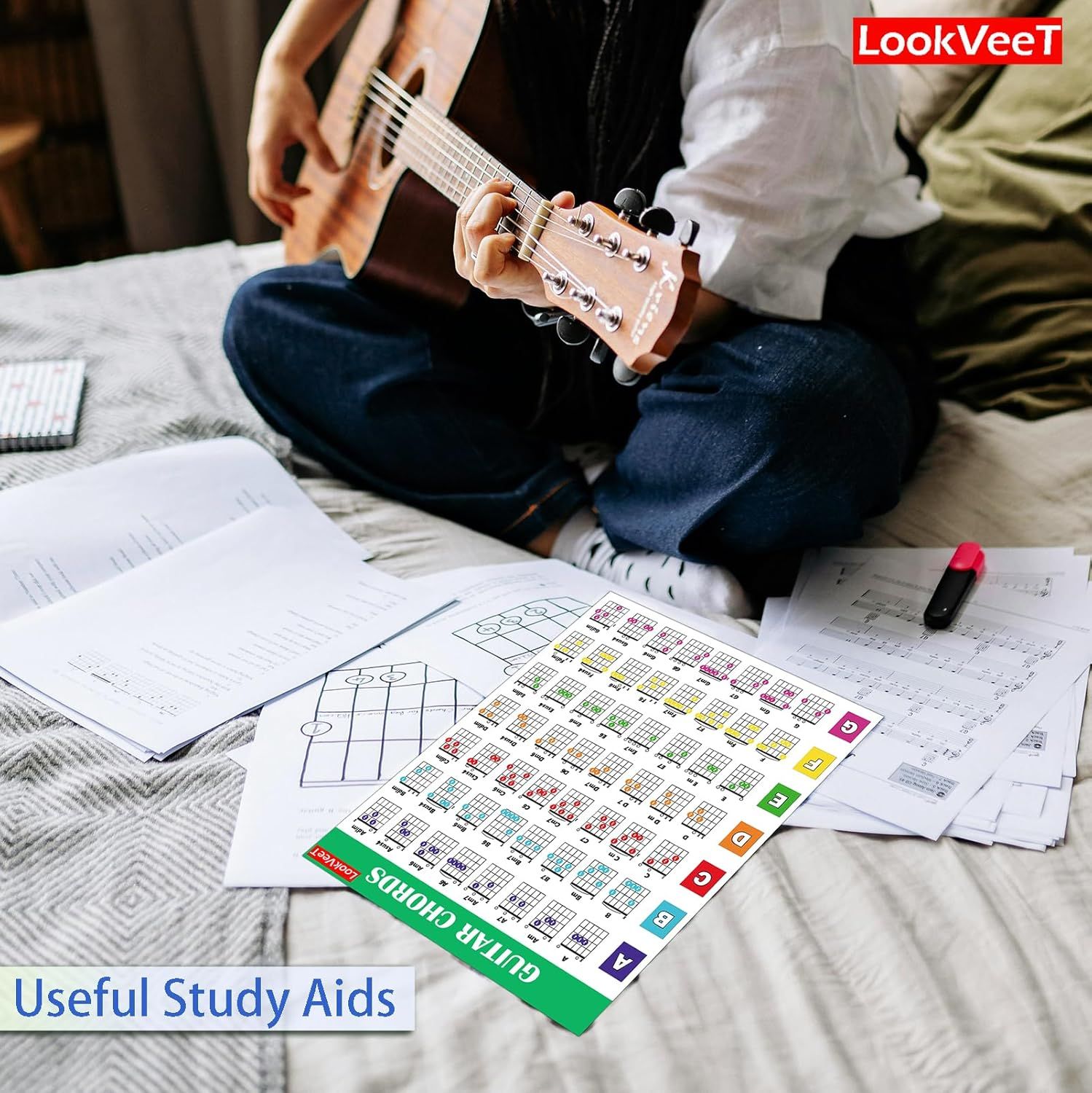 Shows the customer what learning materials and study aids are included with the product to help them learn guitar chords and music theory.