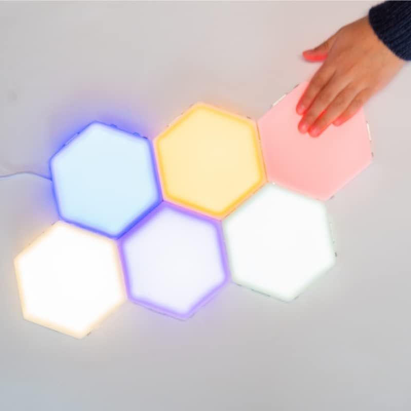Demonstrates the interactive touch-sensitive feature that allows users to change the color of the hexagonal light panels by tapping them.
