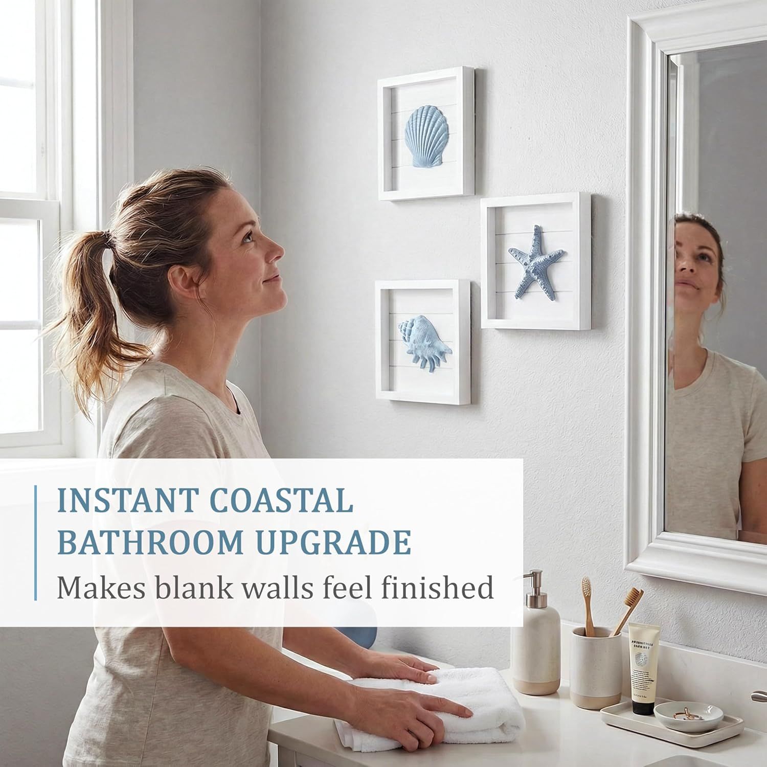 Communicates that the product instantly upgrades bathroom aesthetics by making blank walls feel finished and coastal-themed.