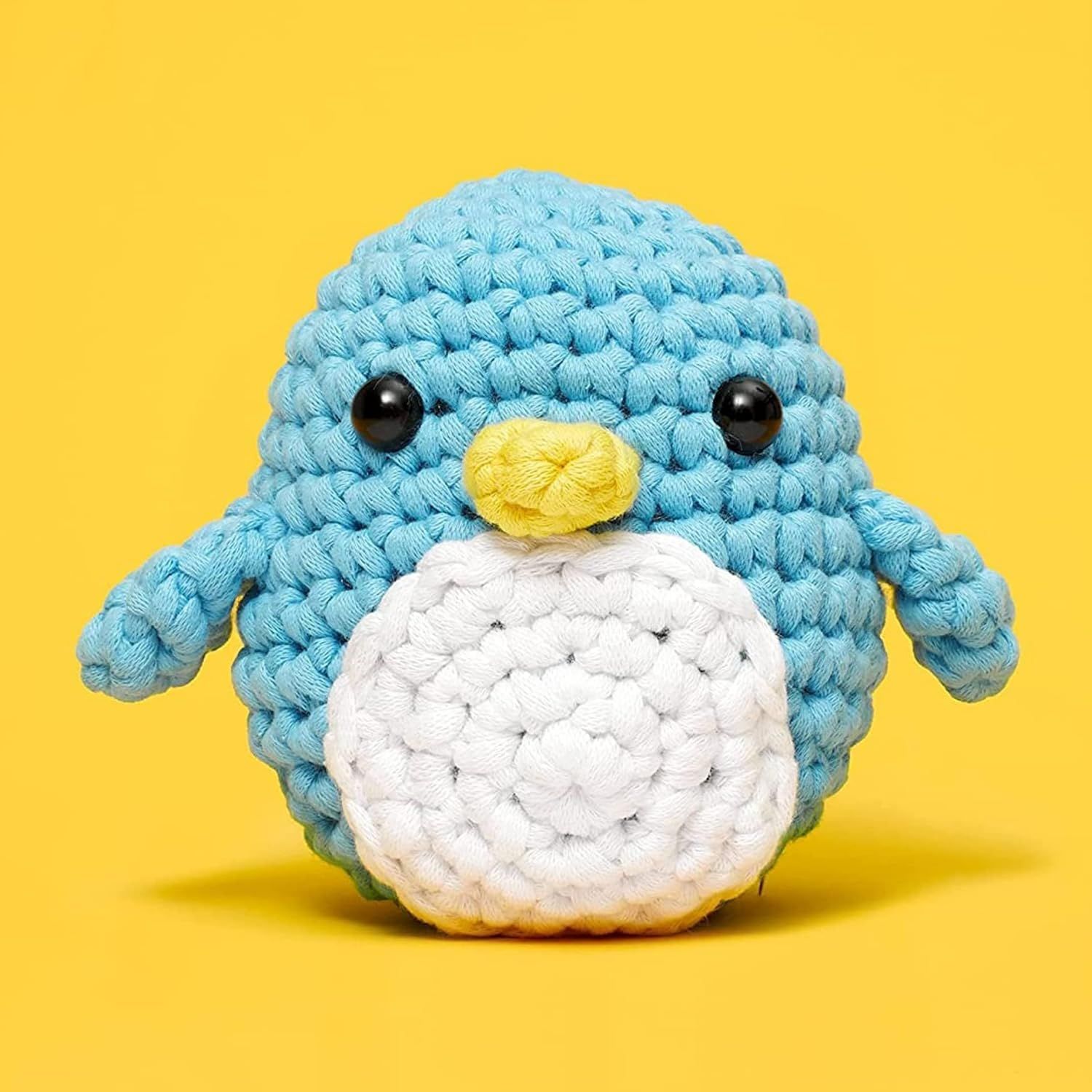 Shows the crocheted penguin toy in a clean, appealing presentation to help shoppers visualize the product's appearance and craftsmanship.