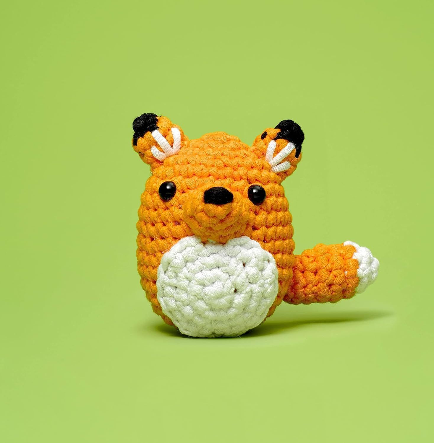 Shows the crocheted toy product in a clean, simple setting to help shoppers visualize the item's appearance and craftsmanship.