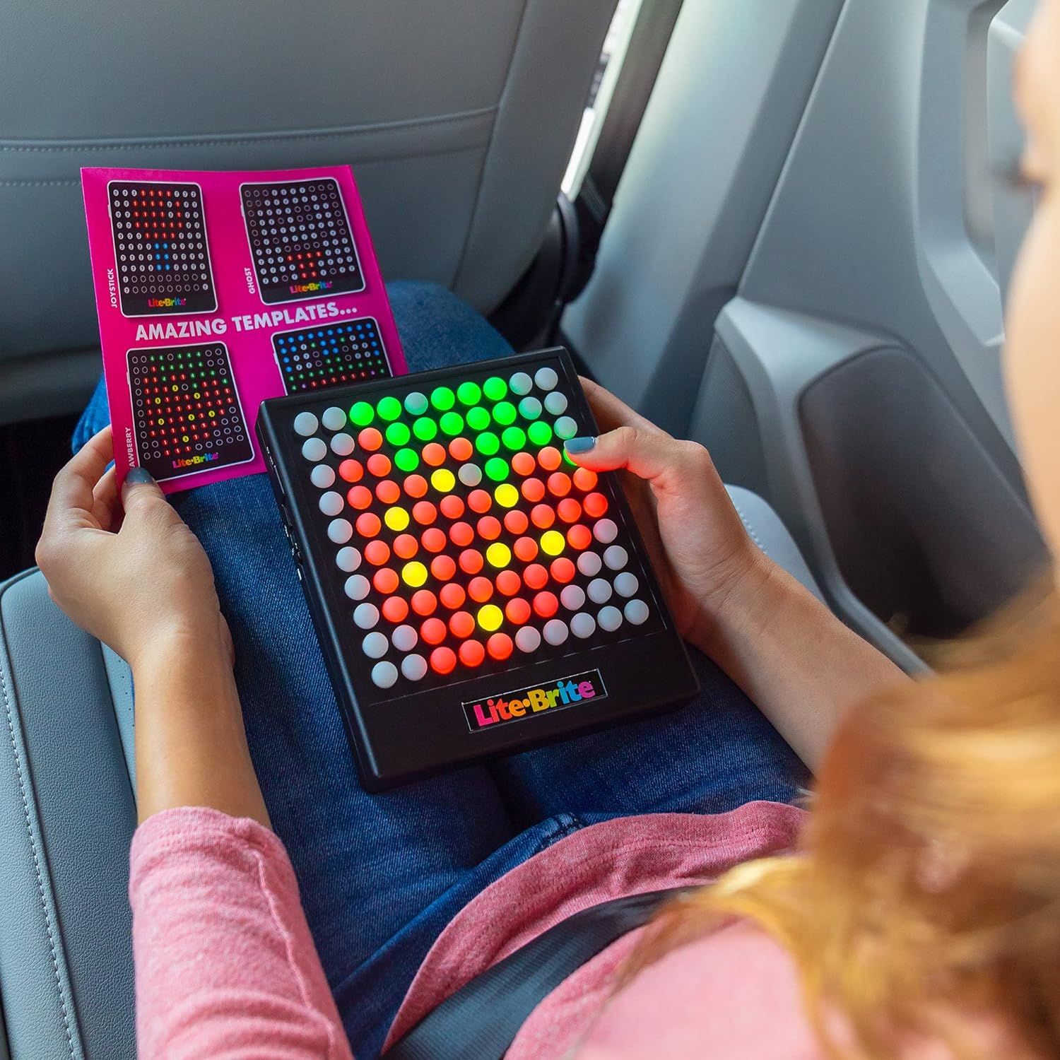 Demonstrates the product being used in a travel or car setting, showing its portability and suitability for keeping children entertained during trips.