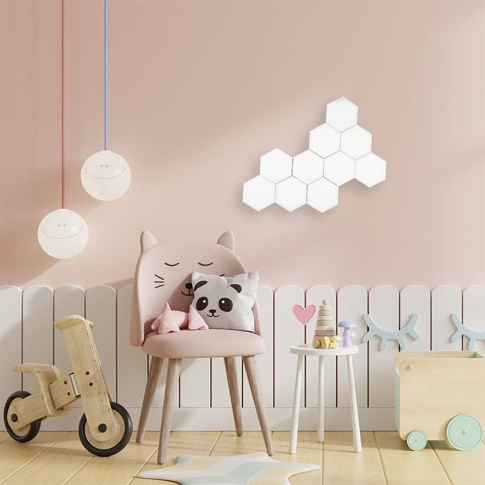 Shows the product (hexagonal wall panels) in a real-world nursery or children's room context to help shoppers visualize how it fits into their home decor.