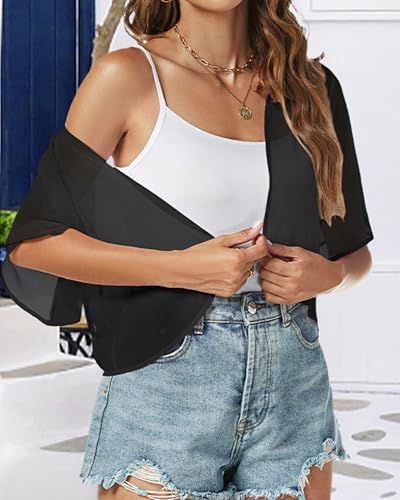 Shows the product being worn in a real-world lifestyle context to help shoppers visualize how the outfit looks when styled with accessories and denim shorts.
