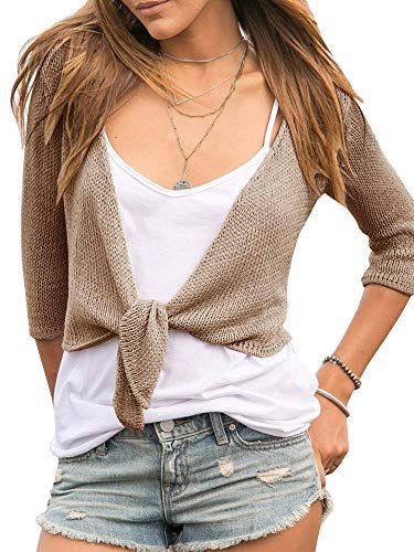 Shows the product worn in a real-world casual setting to help shoppers visualize how the cardigan looks when styled with everyday clothing.