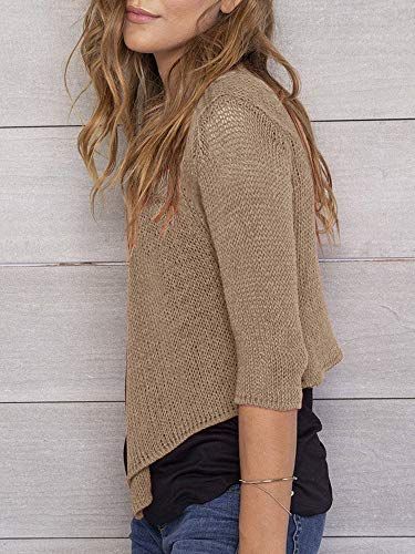 Shows the product being worn in a real-world context to help shoppers visualize fit, drape, and styling of the sweater.
