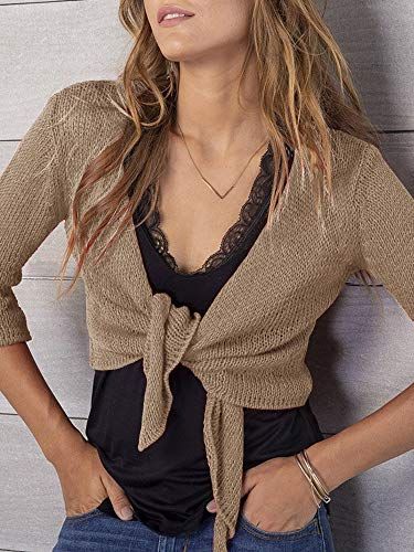 Shows the product being worn in a real-world casual setting to help shoppers visualize how the cardigan looks when styled with everyday clothing.