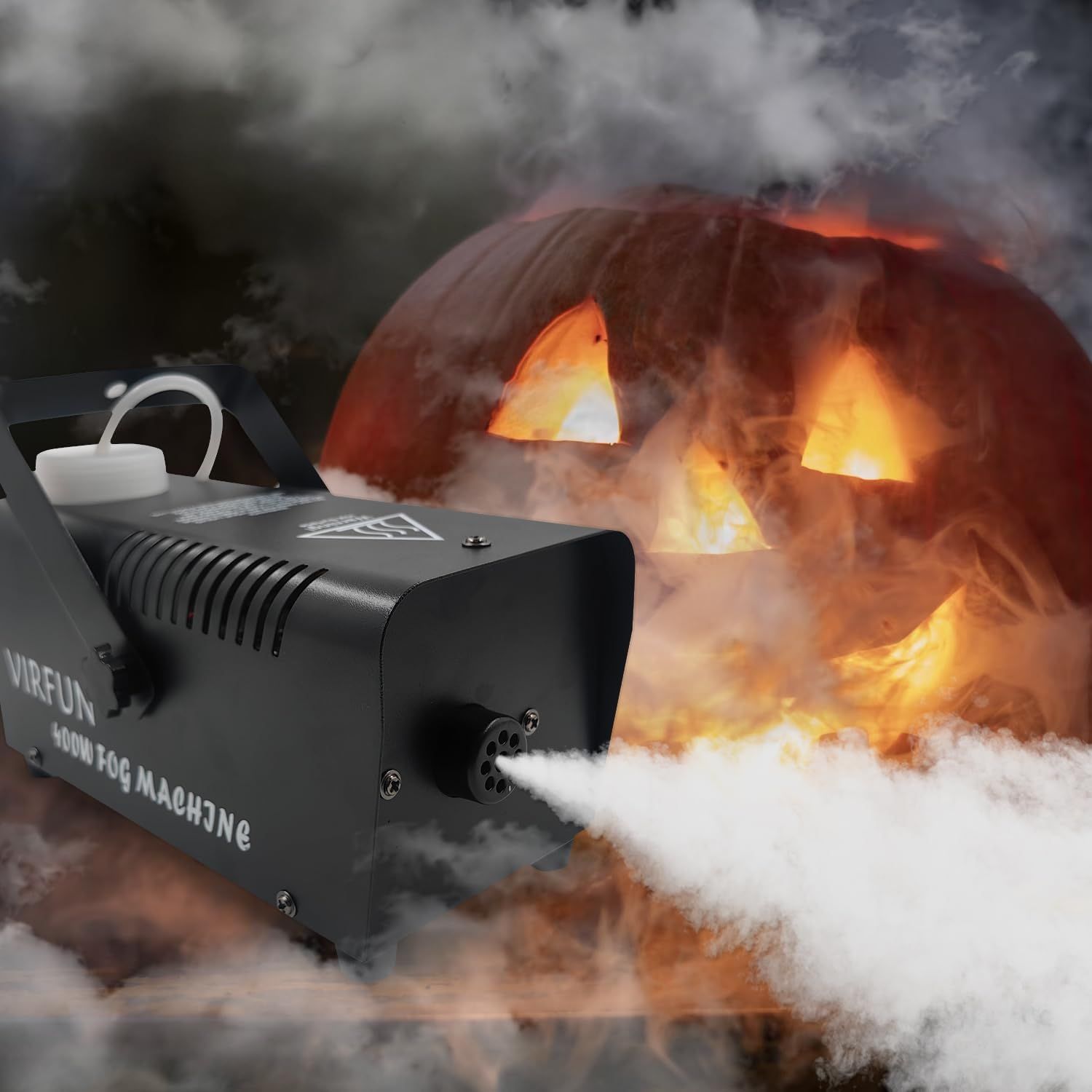Demonstrates the fog machine being used to create atmospheric effects for Halloween decorations, showing shoppers a specific seasonal use case for the product.