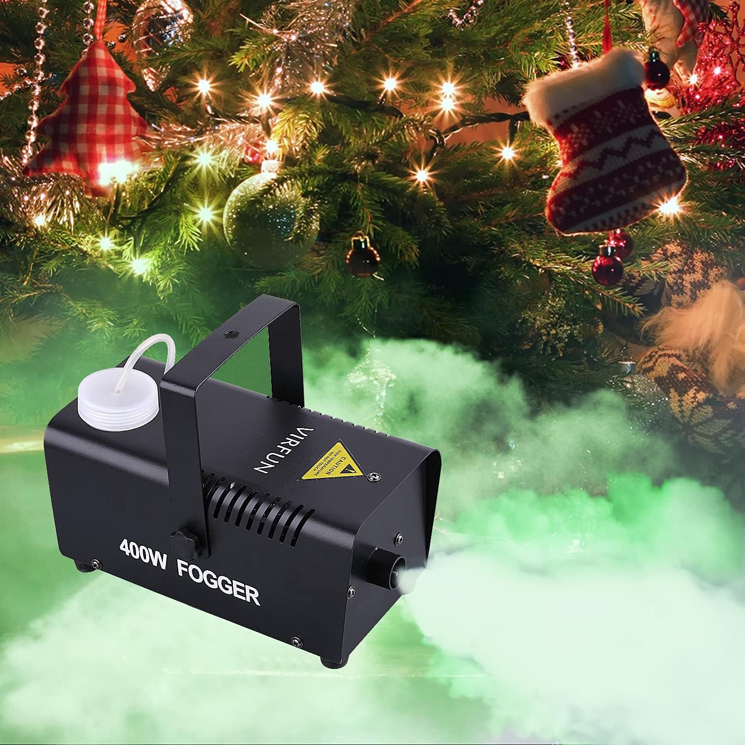 Demonstrates the fog machine as a festive addition to Christmas decorations, showing how it creates atmospheric effects under a decorated tree to enhance holiday ambiance. Shows a specific use case…