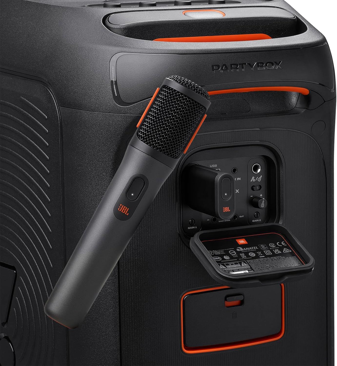 Shows the back panel design and storage features of the speaker system, highlighting where the microphone is stored and the various control ports and compartments available.