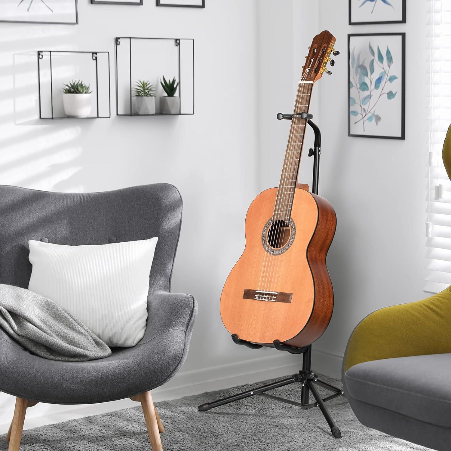 Shows the guitar stand in a real-world home setting to help shoppers visualize how the product fits into their living space and complements modern decor.