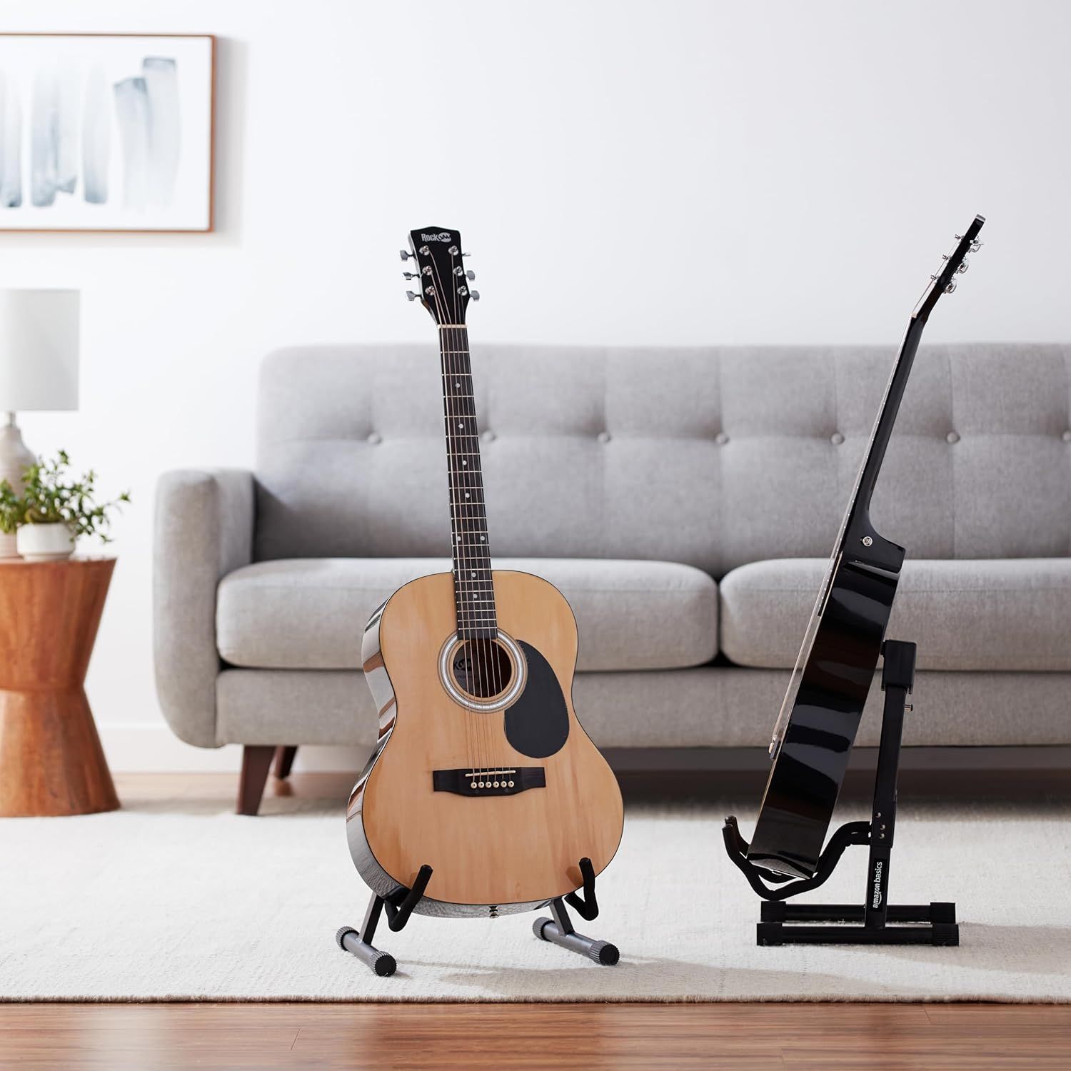 Shows the guitar product in a real-world home setting to help shoppers visualize how it would look in their own living space.
