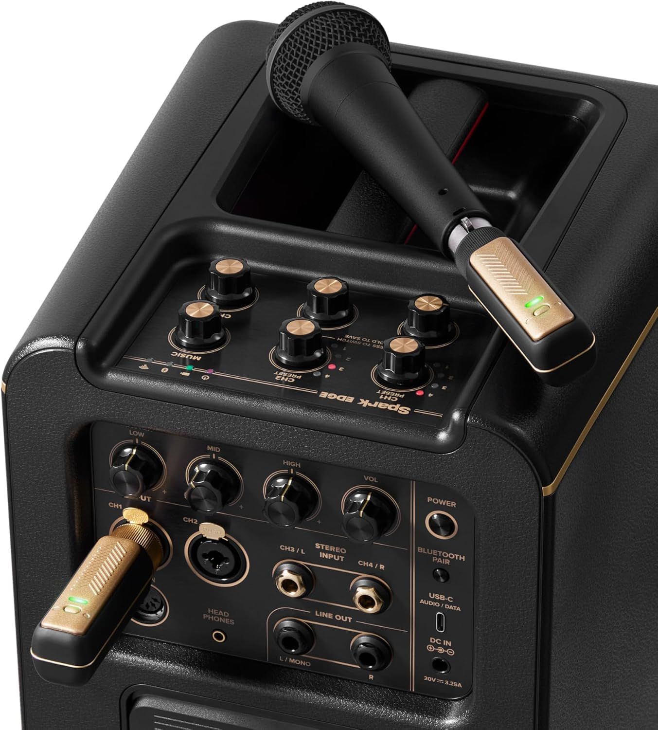 This image showcases the detailed anatomy of the karaoke speaker system, highlighting the control panel with multiple knobs and dials, the microphone storage compartment, wireless microphones, and…